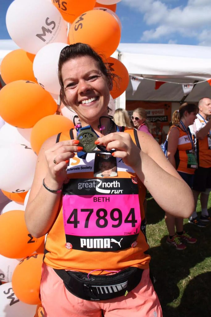 Beth Henderson from the ZytronicTeam showcasing her medal from the Great North Run
