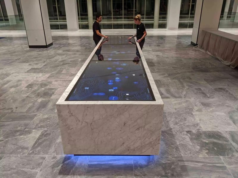 Interactive multi touch table welcomes visitors to corporate headquarters