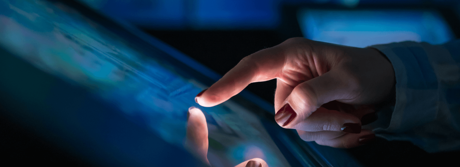 Finger pressing a touchscreen