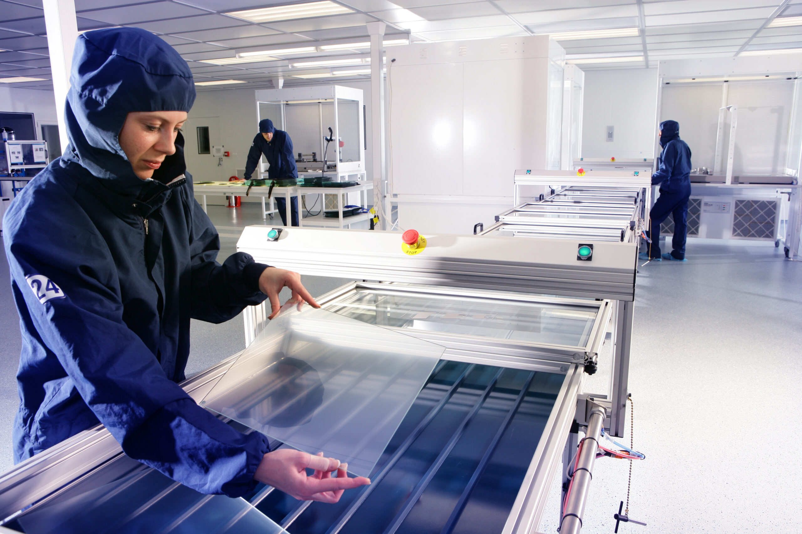 A lady installing lamination on a touchscreen